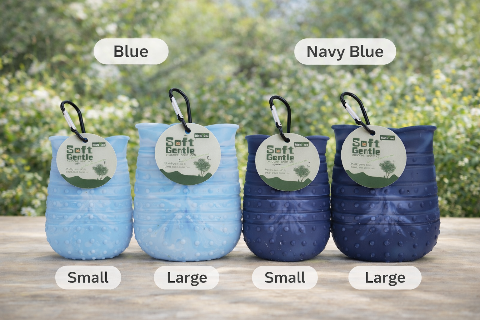 Four blue pet toys with size labels on a wooden surface outdoors.