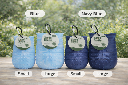 Four blue pet toys with size labels on a wooden surface outdoors.